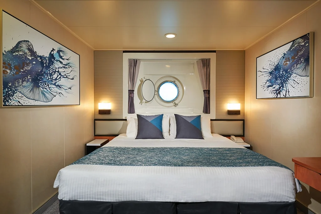 Temptation Cruises Suites Oceanview Porthole 01 1050x700px 2 1024x683 1