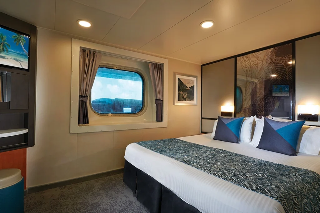 Temptation Cruises Suites Oceanview Stateroom Obstructed View 01 1050x700px 3 1024x683 1